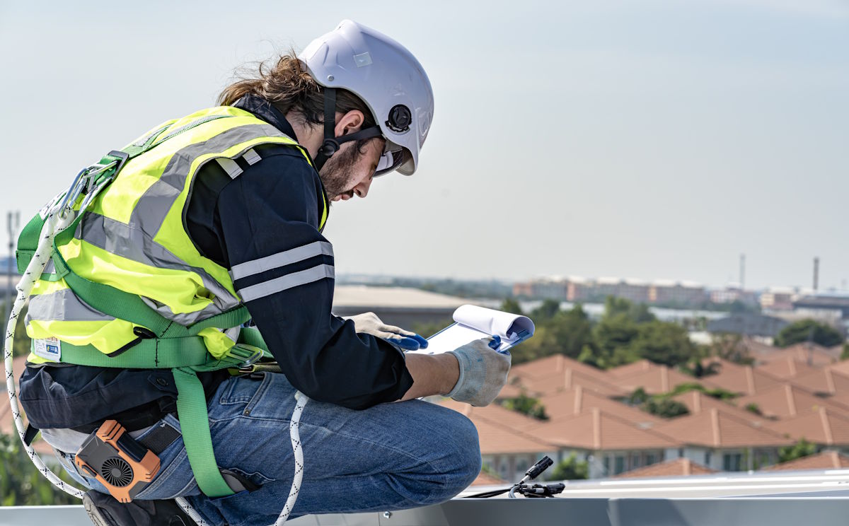roof inspector on roof