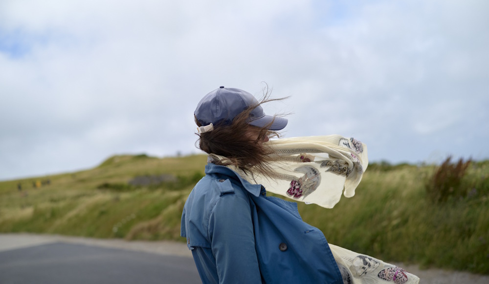 woman standing in the wind